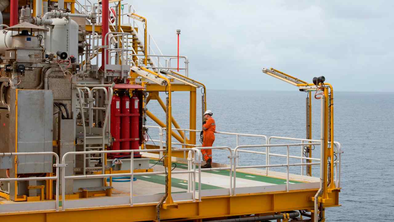 A worker on a converted oil tanker off Angola’s coast